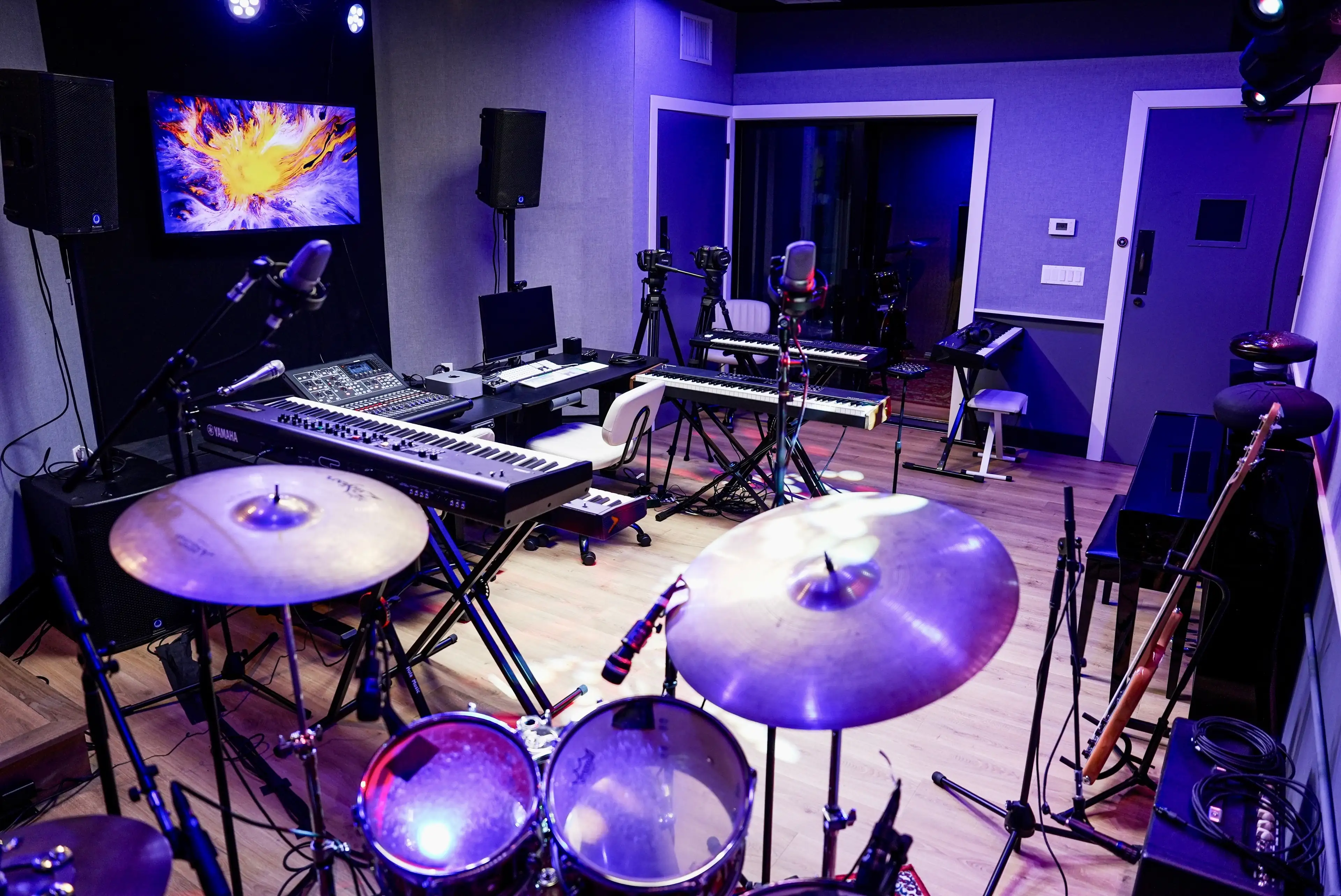 A drum kit with cymbals in a rehearsal room at The Recording Club